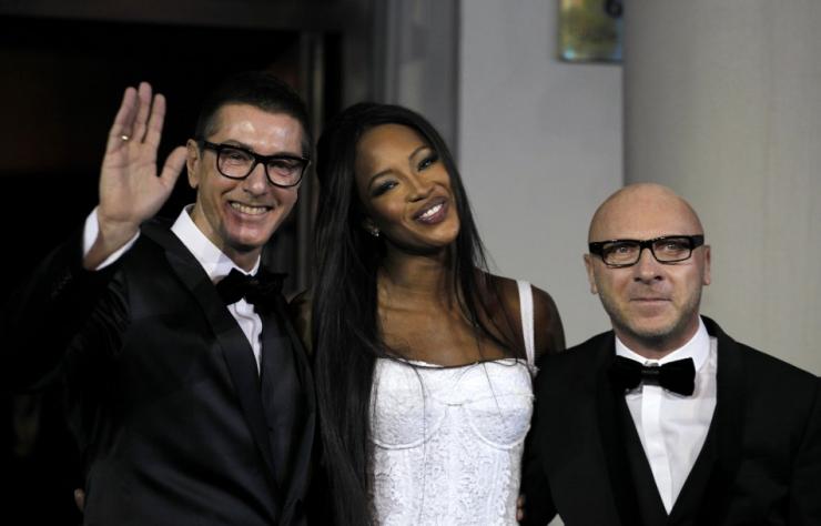 British model Naomi Campbell (C) smiles next to Italian designers Domenico Dolce (R) and Stefano Gabbana during a party marking the 25th anniversary of her career in downtown Shanghai October 28, 2010. 