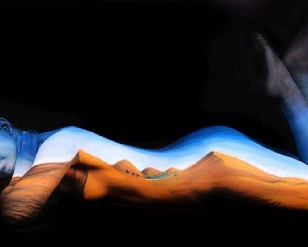 It can be easy to get lost in the desert landscape with body art